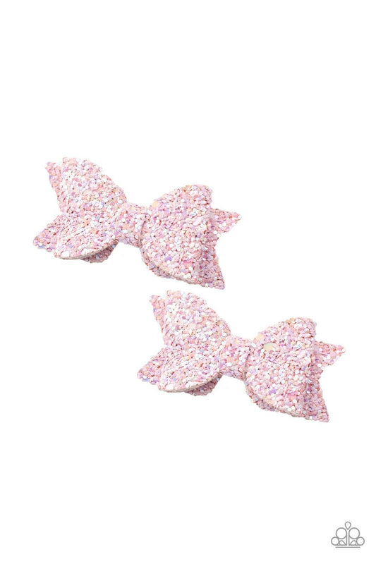 Paparazzi Accessories Sprinkle On The Sequins - Pink Dusted in sparkly sequins, pieces of leather delicately knot into a glittery pair of pink bows for a playful look. Features standard hair clips. Sold as one pair of hair clips. Hair Accessories