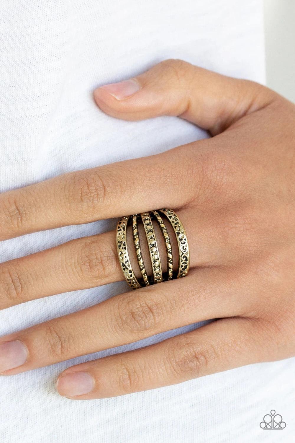 Paparazzi Accessories Textile Bliss - Brass Featuring studded, embossed, and hammered accents, mismatched brass bands stack across the finger for a casual look. Features a stretchy band for a flexible fit. Sold as one individual ring. Jewelry
