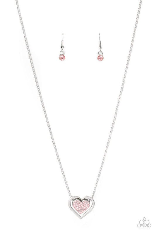 Paparazzi Accessories Game, Set, MATCHMAKER - Pink Bordered in a shiny silver frame, a pink rhinestone encrusted silver heart is suspended below the collar for a gorgeously romantic look. Features an adjustable clasp closure. Sold as one individual neckla