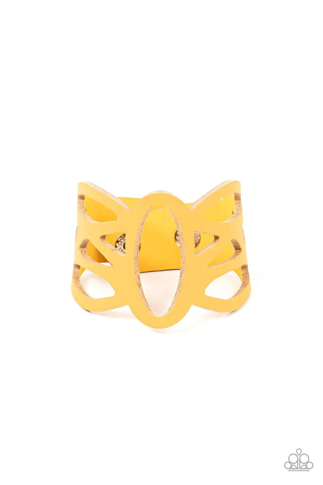 Paparazzi Accessories Rural Rodeo - Yellow A golden yellow leather band has been ornately cut into an airy stenciled pattern, allowing the skin to peek through the leather silhouettes for a natural look. Features an adjustable clasp closure. Sold as one i