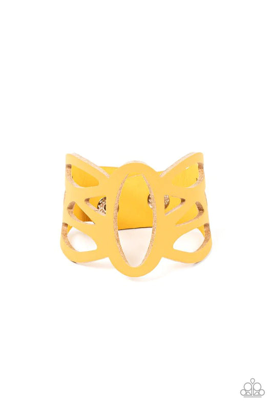 Paparazzi Accessories Rural Rodeo - Yellow A golden yellow leather band has been ornately cut into an airy stenciled pattern, allowing the skin to peek through the leather silhouettes for a natural look. Features an adjustable clasp closure. Sold as one i