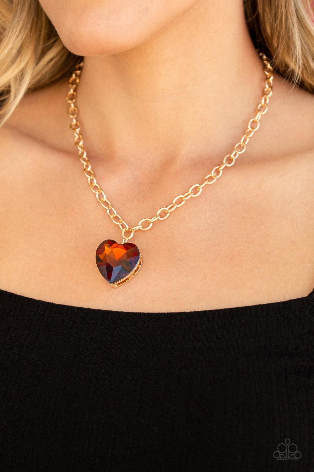 Paparazzi Accessories Flirtatiously Flashy - Brown Set atop a sleek gold fitting, a topaz heart-shaped gem swings from the bottom of a classic gold chain below the collar for a whimsical look. Features an adjustable clasp closure. Jewelry