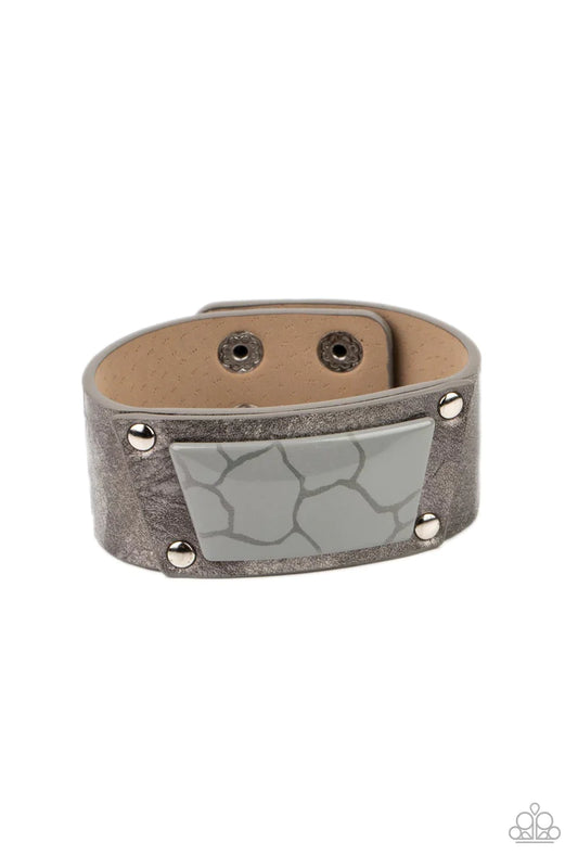 Paparazzi Accessories Geo Glamper - Silver Featuring a faux marble finish, an Ultimate Gray acrylic centerpiece attaches to a silvery leather frame that is studded in place along a distressed silver and gray leather band for a colorfully rustic fashion. F