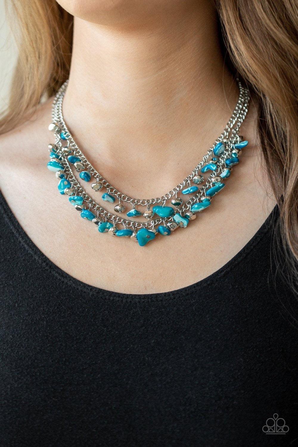 Paparazzi Accessories Pebble Pioneer - Blue Pebble Pioneer Blue. Two strands of refreshing blue pebbles and faceted silver beads swing from the bottoms of two layered chains, creating a colorful fringe below the collar. Features an adjustable clasp closur