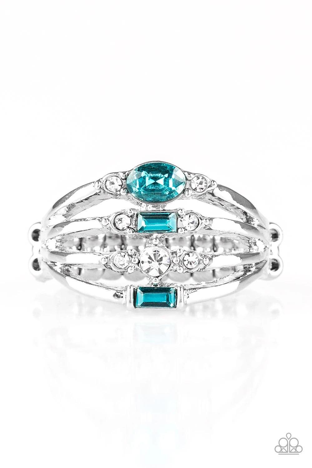 Paparazzi Accessories Not So Novice - Blue Featuring round, oval, and emerald style cuts, dainty blue and white rhinestones are sprinkled along dainty silver bands, coalescing into a refined frame. Features a dainty stretchy band for a flexible fit. Sold