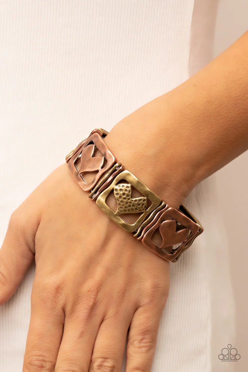 Paparazzi Accessories Legendary Lovers - Multi Encased in hammered frames, hammered copper hearts and brass hearts featuring a hammered dotted motif join pairs of wavy brass and copper frames along stretchy bands around the wrist for a romantic flair. Sol