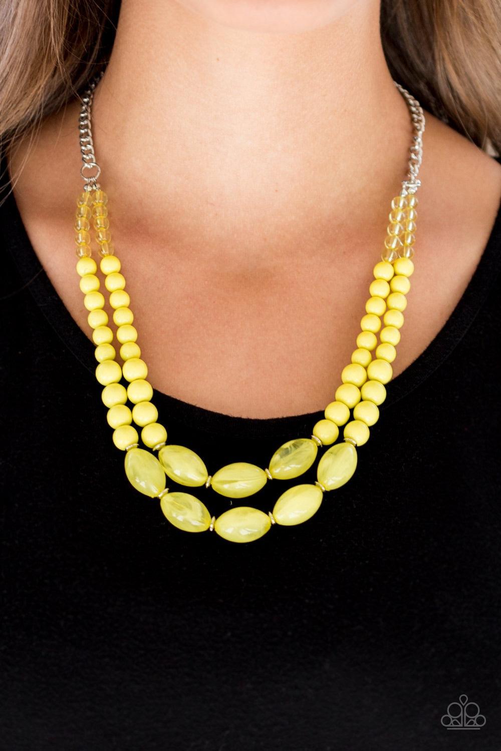 Paparazzi Accessories Sundae Shoppe - Yellow A collection of glassy, polished, and cloudy yellow beads are threaded along two invisible wires below the collar for a beautiful pop of color. Features an adjustable clasp closure. Jewelry