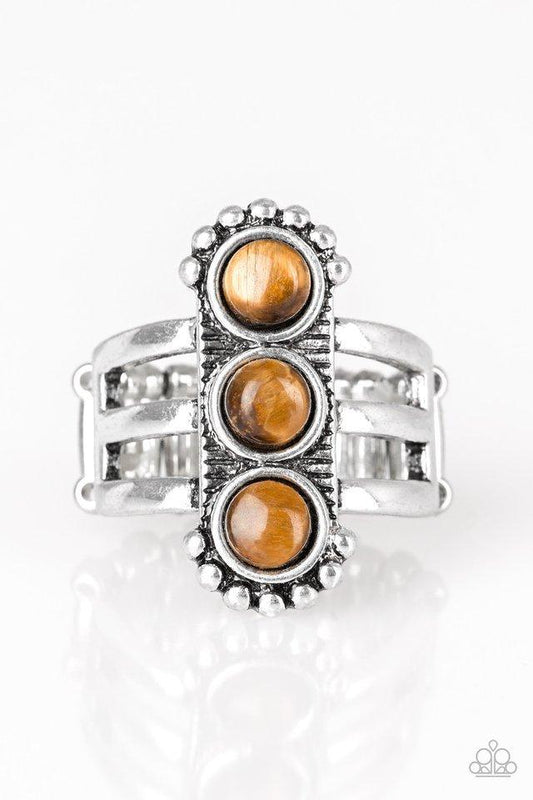 Paparazzi Accessories Rio Trio - Brown Infused with glassy tiger's eye stones, a studded silver frame is pressed into the center of a layered silver band for a seasonal look. Features a stretchy band for a flexible fit. Sold as one individual ring. Jewelr