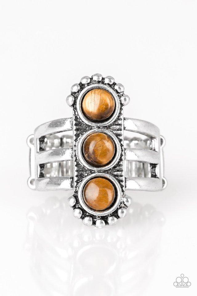 Paparazzi Accessories Rio Trio - Brown Infused with glassy tiger's eye stones, a studded silver frame is pressed into the center of a layered silver band for a seasonal look. Features a stretchy band for a flexible fit. Sold as one individual ring. Jewelr