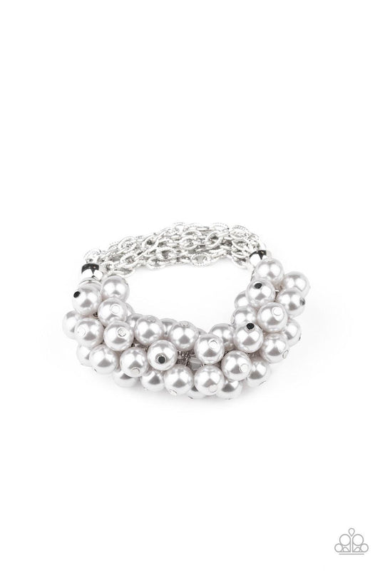 Paparazzi Accessories Up Class Clash - Silver Infused with a stretchy band, sections of shimmery silver chains join clusters of bubbly silver pearls around the wrist, adding a timeless twist to a classic pearl palette. Jewelry