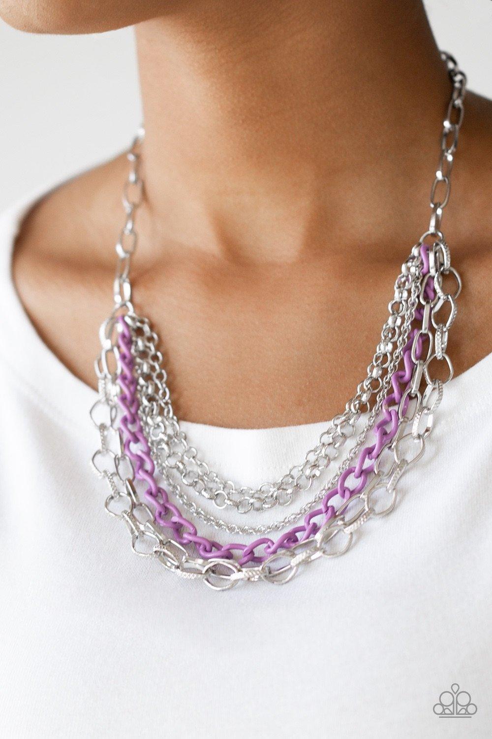 Paparazzi Accessories Color Bomb - Purple Mismatched silver chains layer below the collar for a bold industrial look. Painted in a colorful finish, a shiny purple chain drapes between the shimmery silver chains for a vivacious finish. Features an adjustab