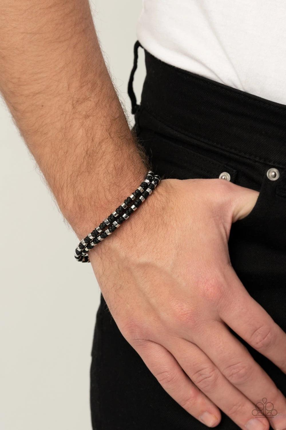 Paparazzi Accessories Ripcord - Black Dainty silver rings adorn a knotted black cord that double wraps around the wrist, creating edgy layers. Features a button loop closure. Sold as one individual bracelet. Jewelry