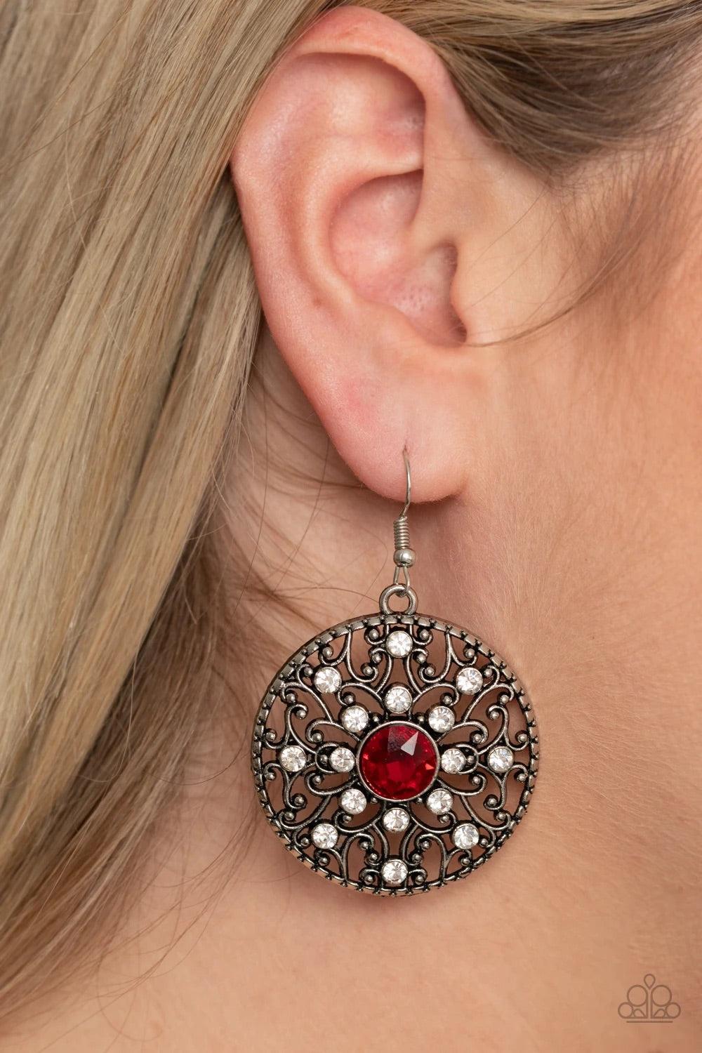 Paparazzi Accessories GLOW Your True Colors - Red Dotted in glassy white rhinestones, a backdrop of studded silver vine-like filigree climbs a circular frame. An oversized red rhinestone embellishes the center for a whimsical finish. Earring attaches to a