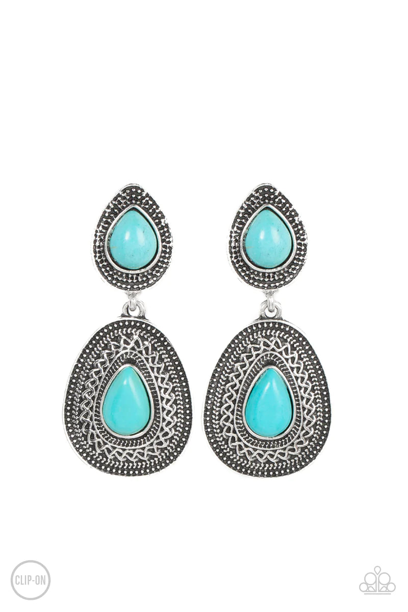 Paparazzi Accessories Country Soul - Blue *Clip-On Dotted with turquoise teardrop stones, rustic silver frames that are decoratively embossed and studded in patterns delicately link into an artisan inspired lure. Earring attaches to a standard clip-on fit