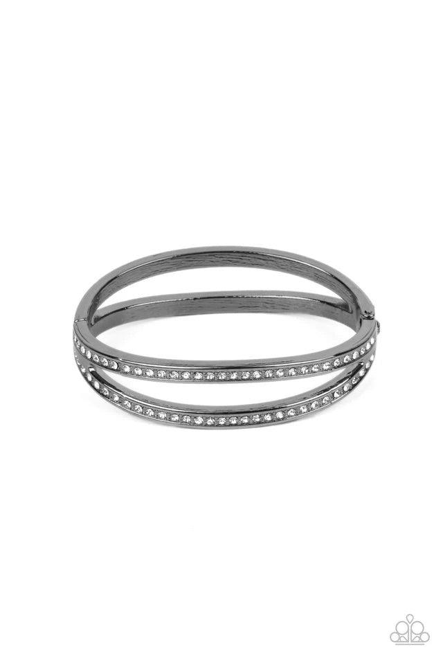 Paparazzi Accessories A Show of FIERCE - Black Encrusted in glassy white rhinestones, an oval gunmetal frame attaches to a matching shiny frame, creating a timelessly layered bangle-like cuff around the wrist. Features a hinged closure. Jewelry