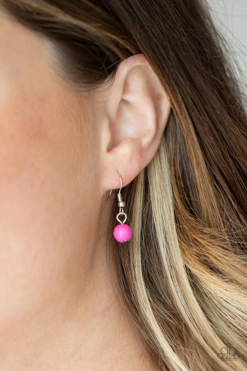 Paparazzi Accessories Plateau Paradise - Pink A dramatically oversized pink pearl gives way to two mismatched strands of classic pink pearls that graduate in size and imperfect finishes, adding a timeless twist to the classic pearl palette. Features an ad