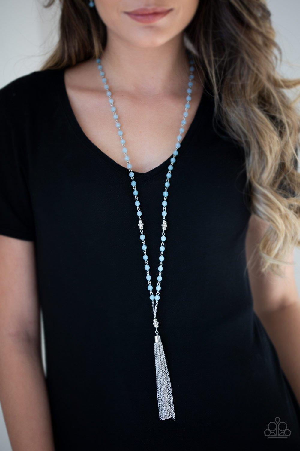 Paparazzi Accessories Tassel Takeover - Blue Blue opaque crystal-like beads, shiny silver beads, and white rhinestone encrusted rings give way to a shimmery silver tassel for a whimsical look. Features an adjustable clasp closure. Sold as one individual n