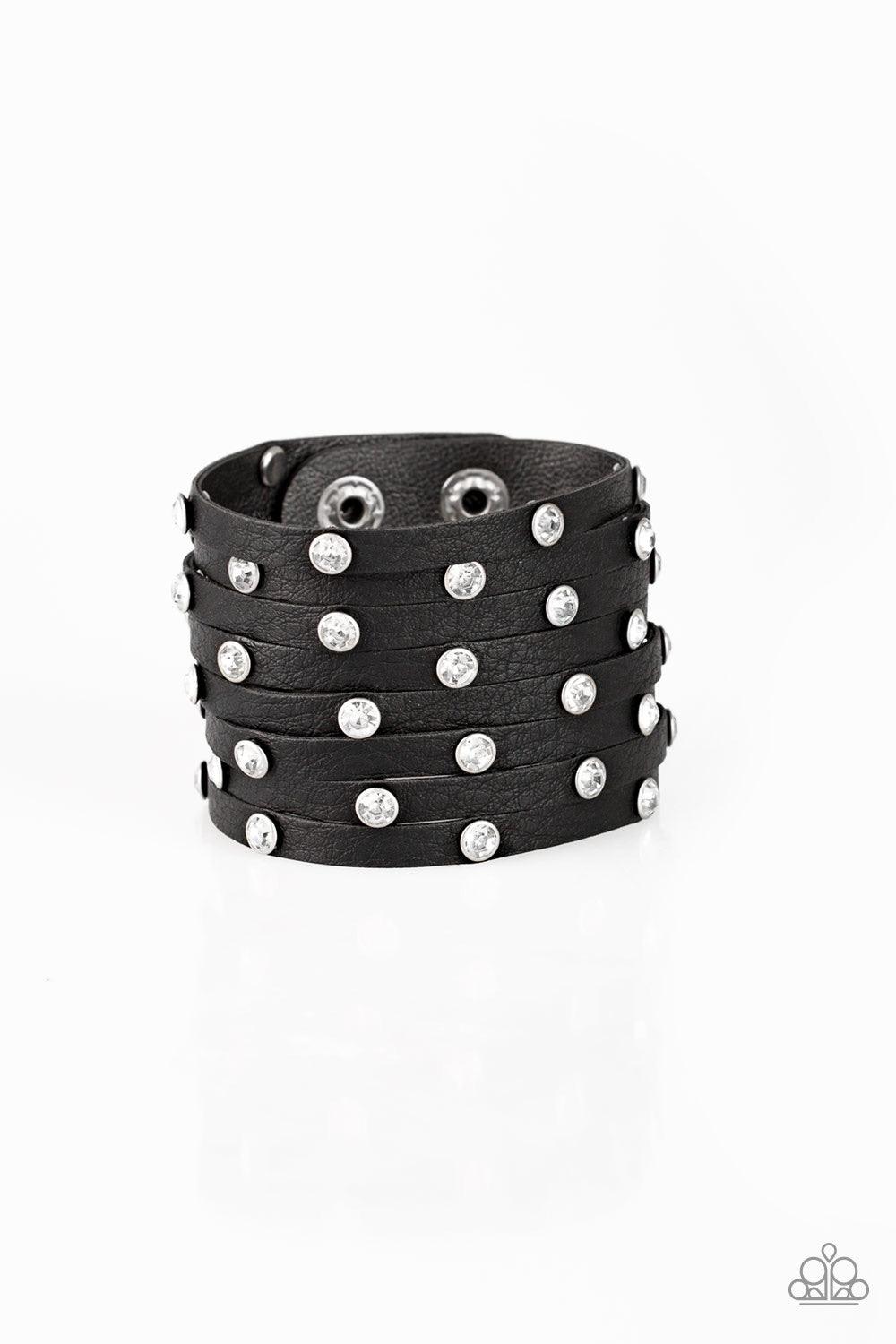 Paparazzi Accessories Sass Squad - Black A thick black leather band has been spliced into numerous black strands. Featuring sleek black frames, glittery white rhinestones are sprinkled across the leather bands for a sassy finish. Features an adjustable sn