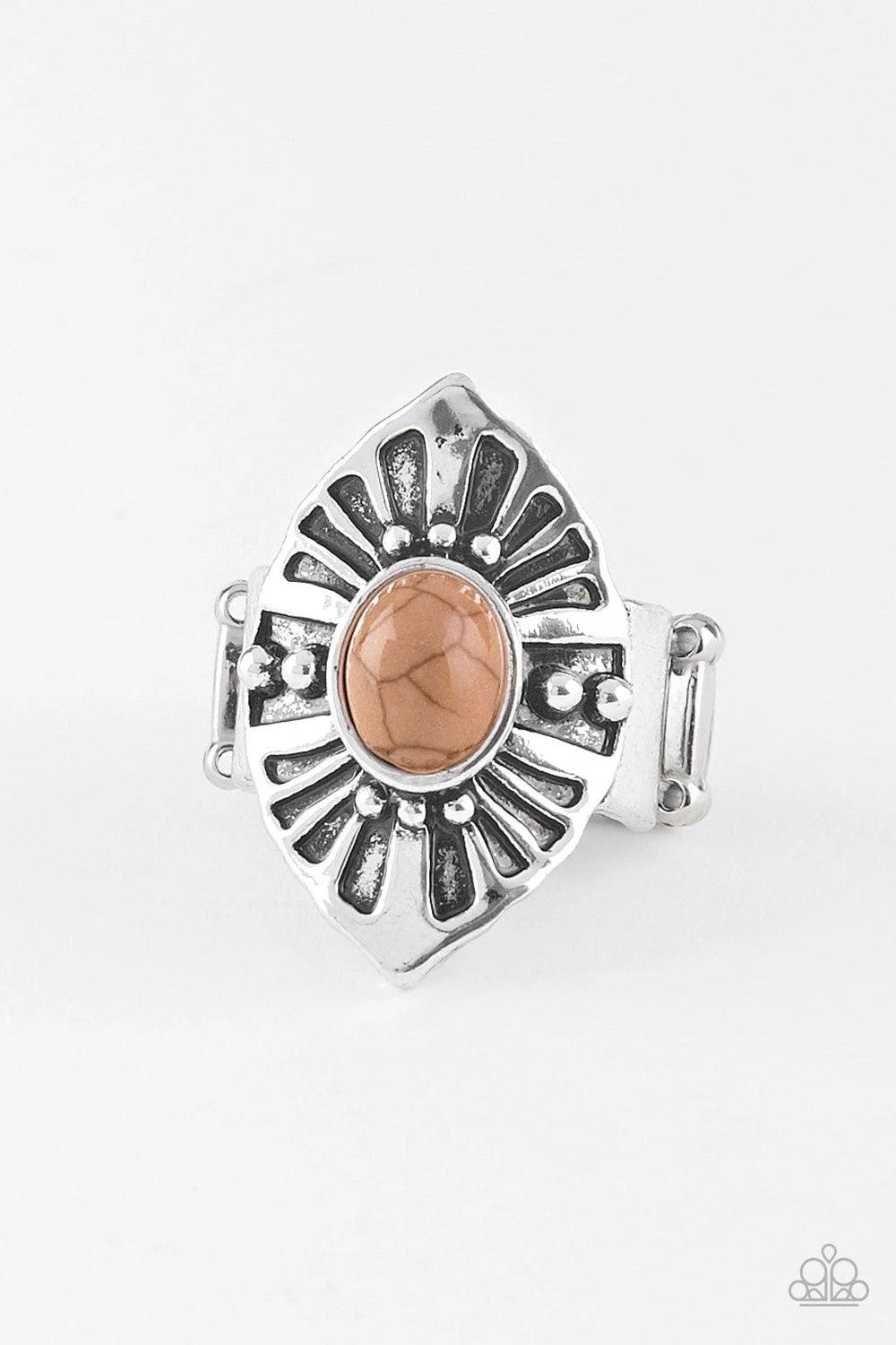 Paparazzi Accessories HOMESTEAD For The Weekend - Brown An earthy brown stone bead is pressed into the center of an angular silver frame radiating with studded and antiqued textures. Features a stretchy band for a flexible fit. Sold as one individual ring