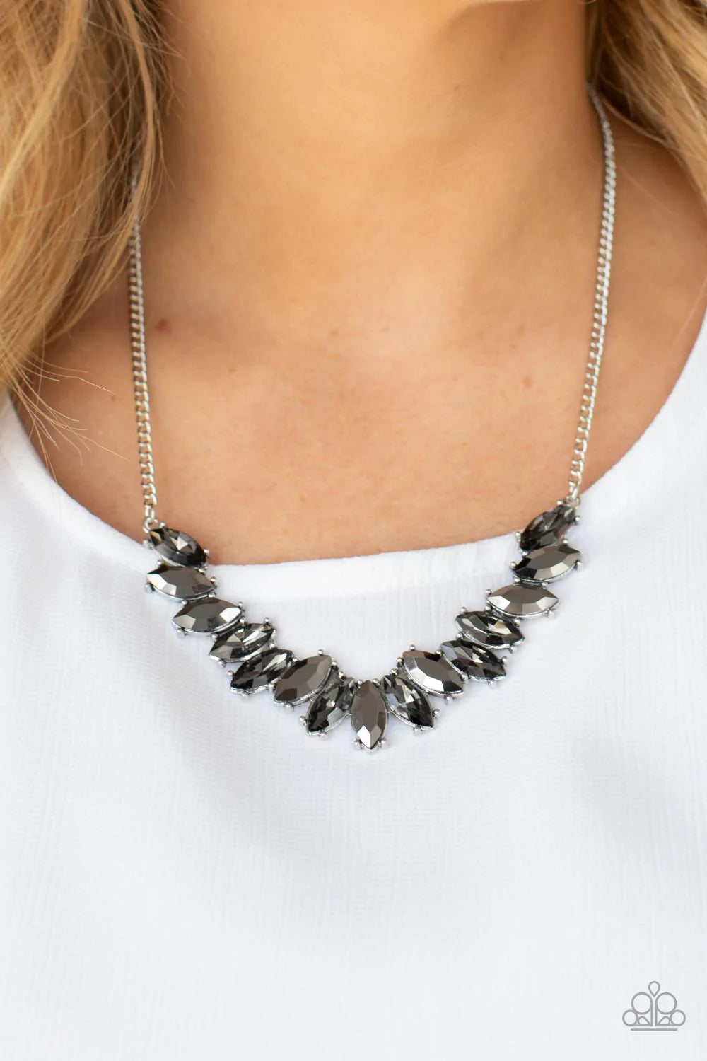 Paparazzi Accessories Galaxy Game-Changer - Silver Featuring pronged silver fittings, a sparkly series of smoky and hematite marquise cut rhinestones fan out below the collar for a stellar statement-making look. Features an adjustable clasp closure. Sold