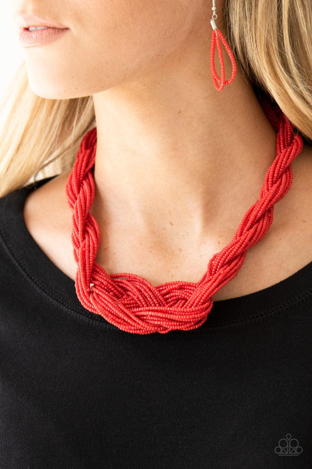 Paparazzi Accessories A Standing Ovation - Red Countless strands of red seed beads are twisted and knotted together to create an unforgettable statement piece. Features an adjustable clasp closure. Sold as one individual necklace. Includes one pair of mat