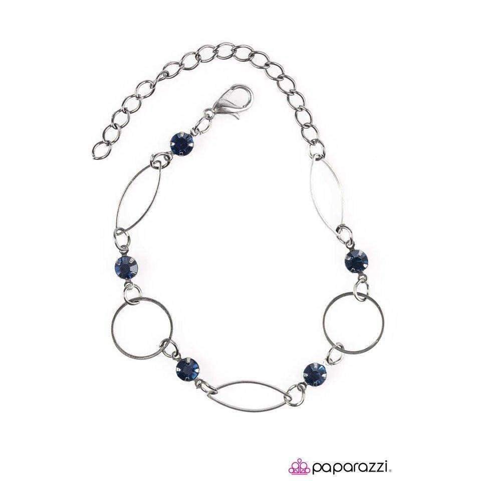 Paparazzi Accessories More Glitter - Blue Elegant marquise shaped frames join classic gunmetal hoops around the wrist. Glittery blue rhinestones trickle between the joined frames, adding a refined sparkle to the timeless palette. Features an adjustable cl