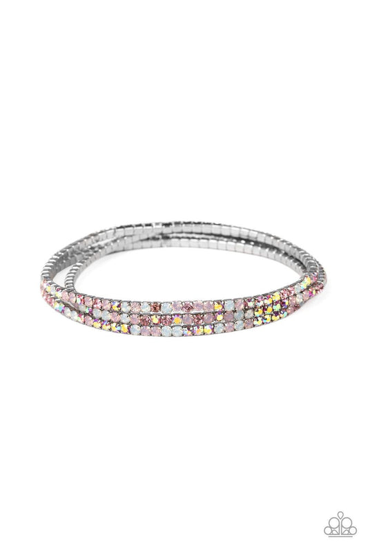 Paparazzi Accessories Sugar and Ice - Pink Featuring classic and opalescent finishes, a collection of dainty pink and white rhinestones are threaded along stretchy bands, creating glittery layers across the wrist. Jewelry