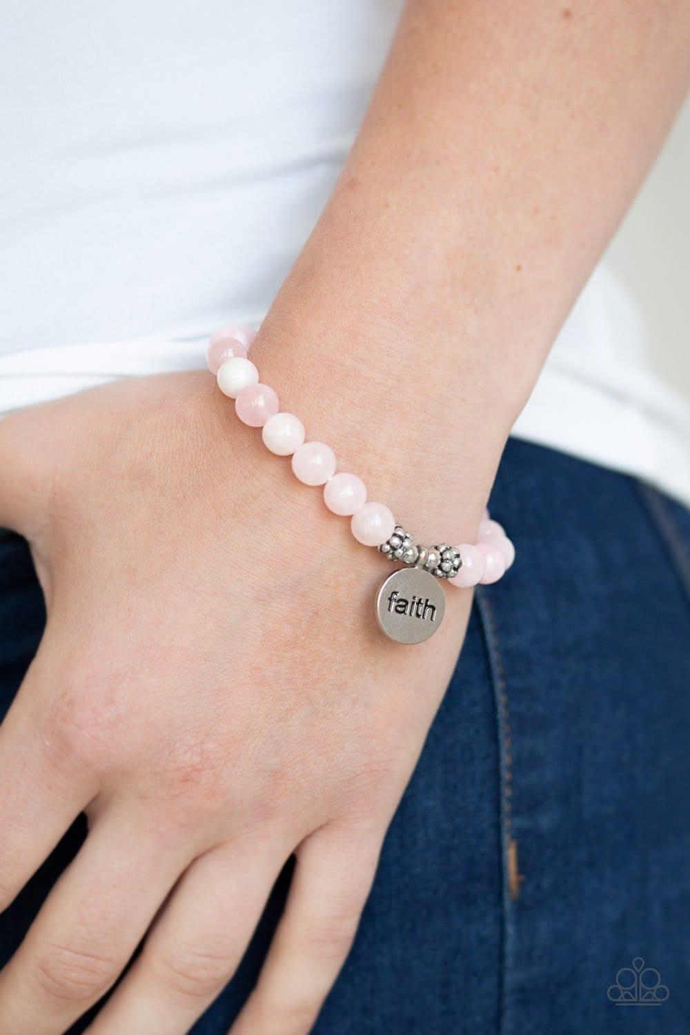 Paparazzi Accessories Faith It, Till You Make It - Pink A refreshing collection of glassy stone beads are threaded along a stretchy band around the wrist for a seasonal flair. A shimmery silver disc stamped in the word, "faith," swings from the wrist for
