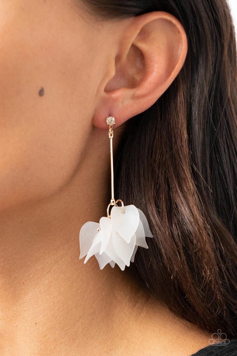 Paparazzi Accessories Suspended in Time - Gold A collection of curving white acrylic petals cluster at the bottom of a golden rod that is attached to a dainty white rhinestone for a refined finish. Earring attaches to a standard post fitting. Sold as one