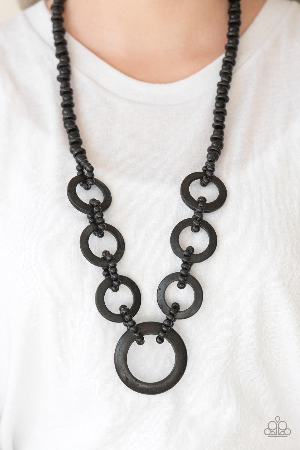 Paparazzi Accessories Endless Summer - Black Mismatched black wooden beads are threaded along a black cord for an earthy look. Brushed in a distressed finish, black discs connect with beaded links across the chest for a summery finish. Jewelry