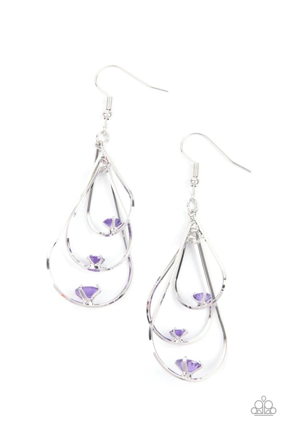 Paparazzi Accessories Drop Down Dazzle - Purple Gradually increasing in size, lavender rhinestones are fitted in place atop the bottom centers of three interlocking silver teardrops, creating a glamorous lure. Earring attaches to a standard fishhook fitti