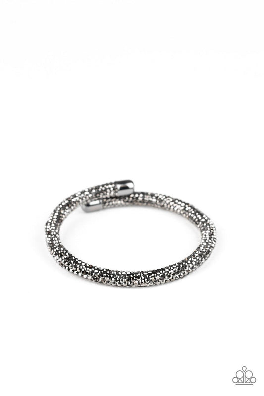 Paparazzi Accessories Stageworthy Sparkle - Black Bedazzled in glittery hematite rhinestones, a bendable cuff-like bracelet delicately curls around the wrist for a refined look. Jewelry