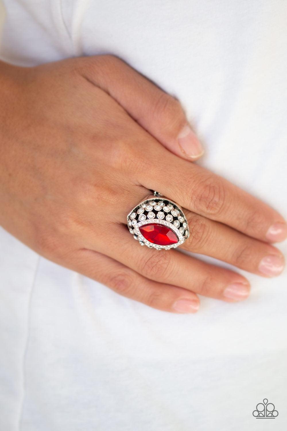 Paparazzi Accessories Royal Radiance - Red Featuring a regal marquise style cut, a fiery red rhinestone is pressed into the center of a silver frame radiating with glittery white rhinestones for a blinding finish. Features a stretchy band for a flexible f
