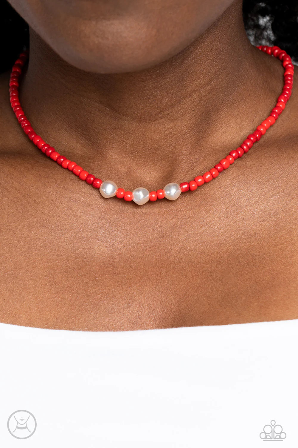 Paparazzi Accessories I Can SEED Clearly Now - Red Stretched along an invisible wire, a collection of red seed beads in various shades circles above the collar for a vibrant pop of color. Three baroque pearls interrupt the beading, adding a refined sheen