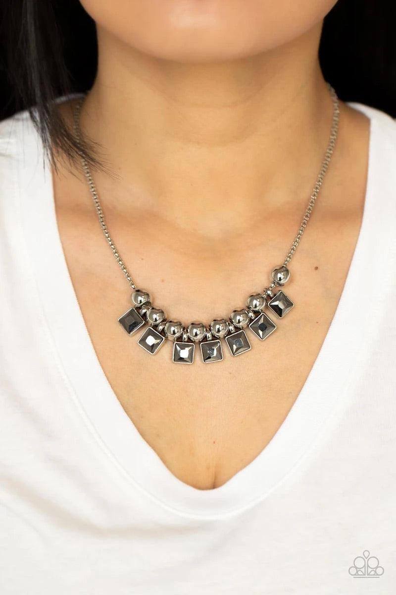 Paparazzi Accessories Graciously Audacious - White Smoky hematite square rhinestone frames and oversized silver beads alternate along a silver popcorn chain, creating a stellar fringe below the collar. Features an adjustable clasp closure. Sold as one ind