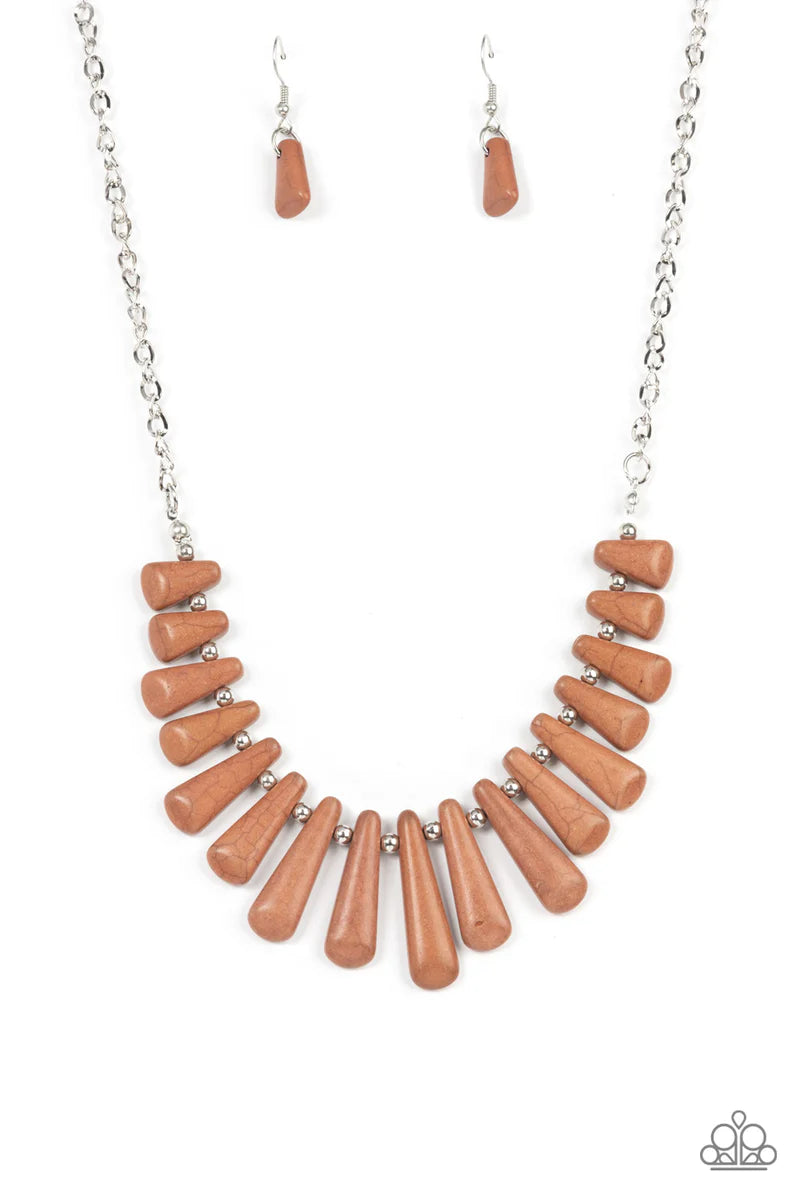 Paparazzi Accessories Mojave Empress - Brown Separated by dainty silver beads, pieces of triangular cut brown stones gradually increase in size as they fan out below the collar for an earthy statement. Features an adjustable clasp closure. Sold as one ind