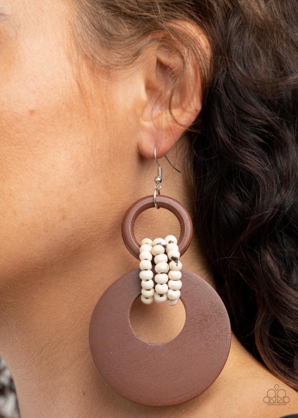 Paparazzi Accessories Beach Day Drama - Brown White wooden beaded links connect together a brown wooden ring and an oversized brown wooden crescent-like hoop, creating a uniquely earthy lure. Earring attaches to a standard fishhook fitting. Sold as one pa