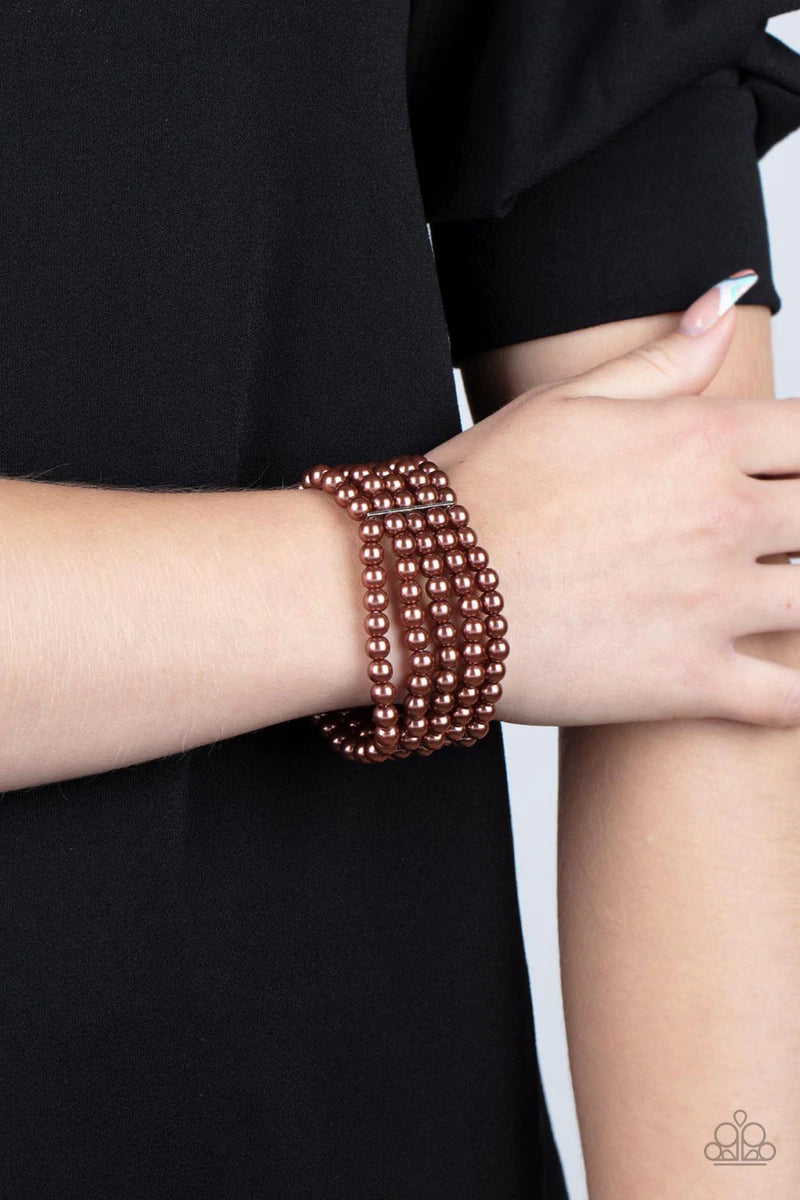 Paparazzi Accessories A Pearly Affair - Brown Stacked layers of luminous brown pearl-like beads are threaded along stretchy bands creating a subtly indulgent allure around the wrist. Sold as one individual bracelet. Jewelry