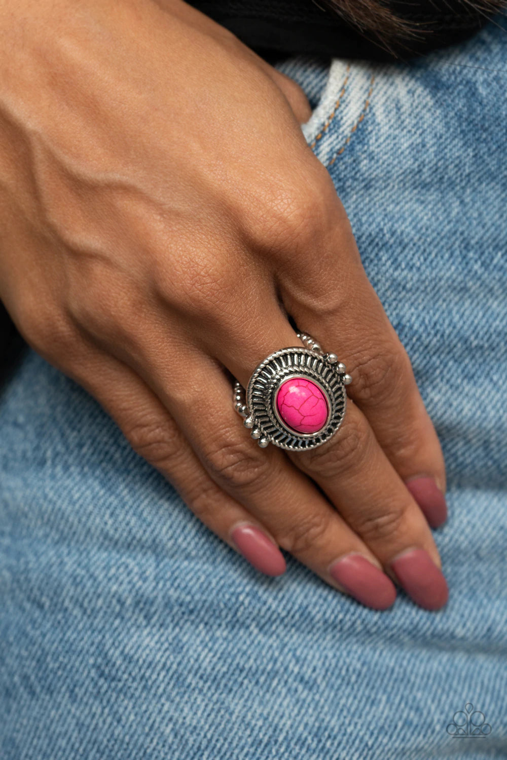 Paparazzi Accessories Badlands To The Bone - Pink An oval pink stone is pressed into the center of an antiqued silver frame radiating with striking linear texture. The colorful centerpiece is held in place with faux pronged silver studs, creating a bold t