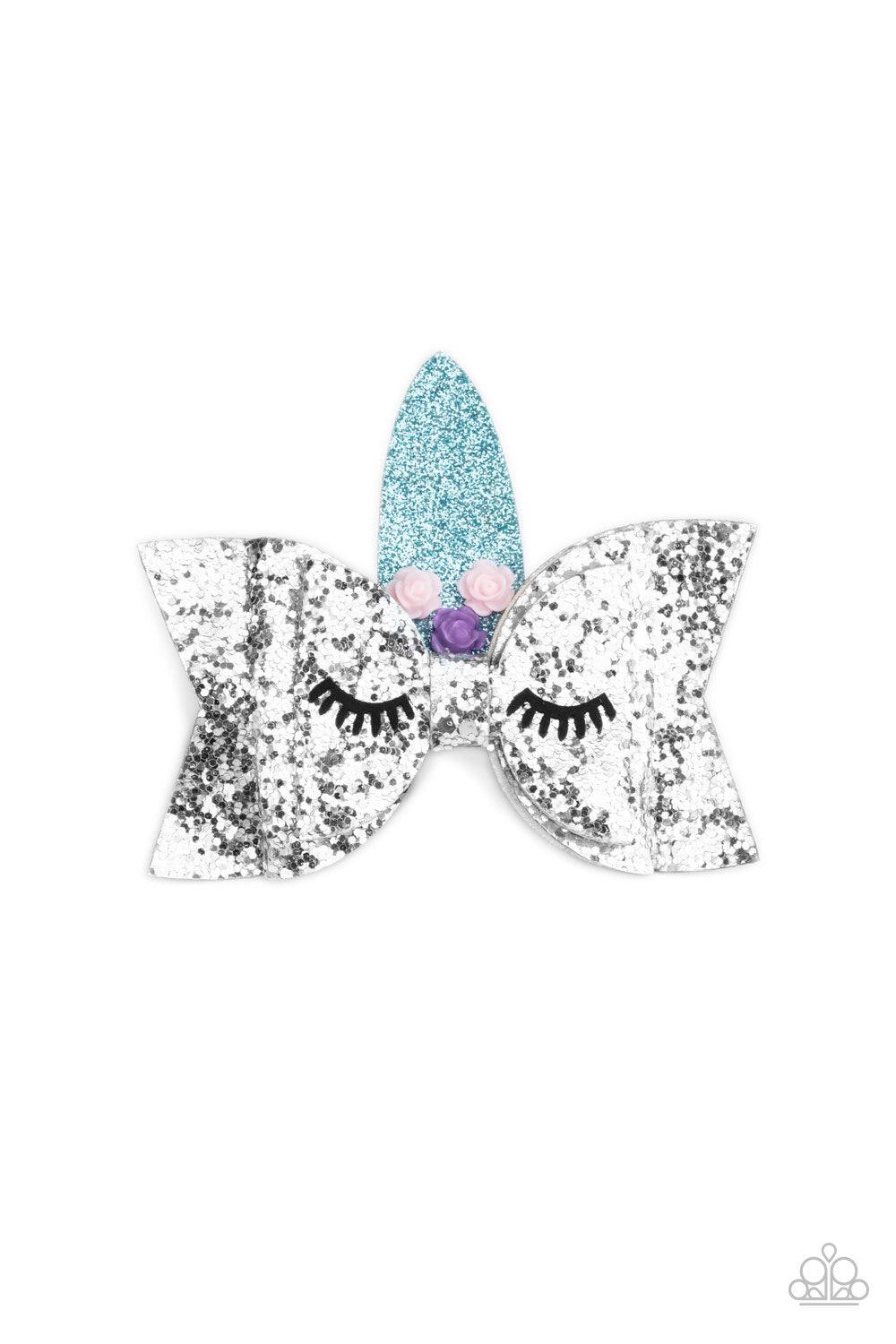 Paparazzi Accessories Just Be A YOU-nicorn - Silver Decorated in pink and purple resin roses, a sparkling blue horn crowns a glittery silver hair bow featuring suede eyelashes, creating an adorable unicorn. Features a standard hair clip on the back. Sold