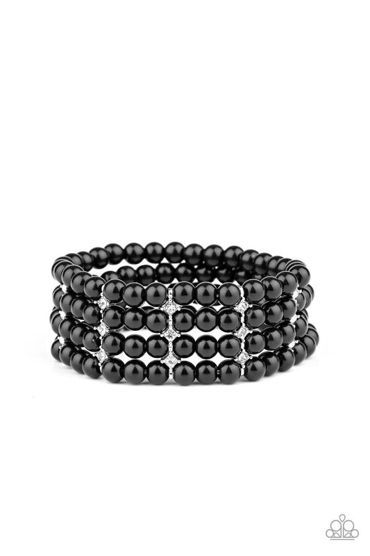 Paparazzi Accessories Stacked To The Top - Black Held together by glittery white rhinestone encrusted silver fittings, row after row of shiny black beads are threaded along stretchy bands around the wrist for a timelessly stacked look. Sold as one individ