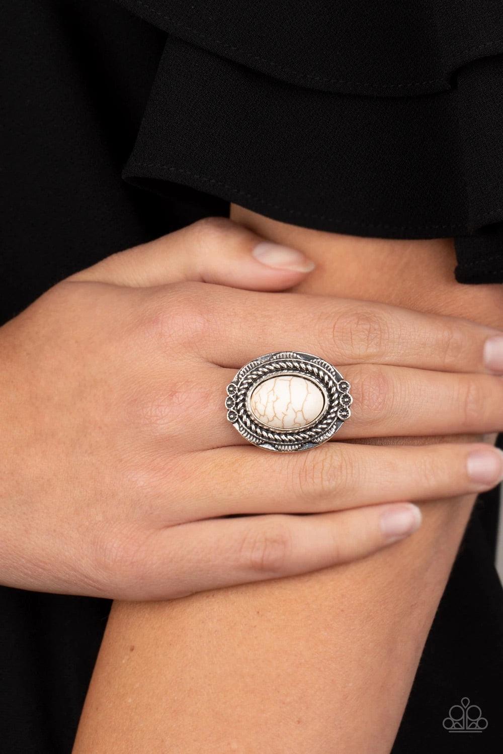 Paparazzi Accessories Tumblin’ Tumbleweeds - White A refreshing white stone is pressed into an antiqued silver frame radiating with floral detail for a seasonal look. Features a stretchy band for a flexible fit. Sold as one individual ring. Jewelry