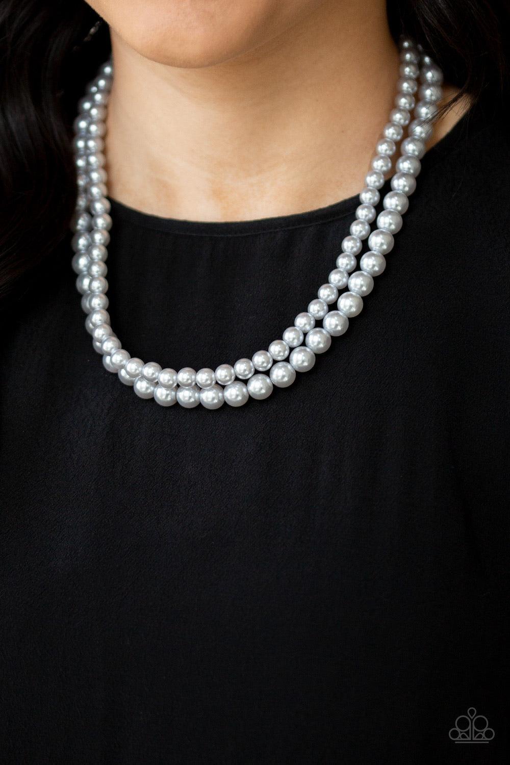Paparazzi Accessories Woman of the Century ~Silver Two strands of classic gray pearls are strung along invisible wires below the collar. Each strand slightly varies in size, adding a modern twist to the timeless pearl palette. Features an adjustable clasp