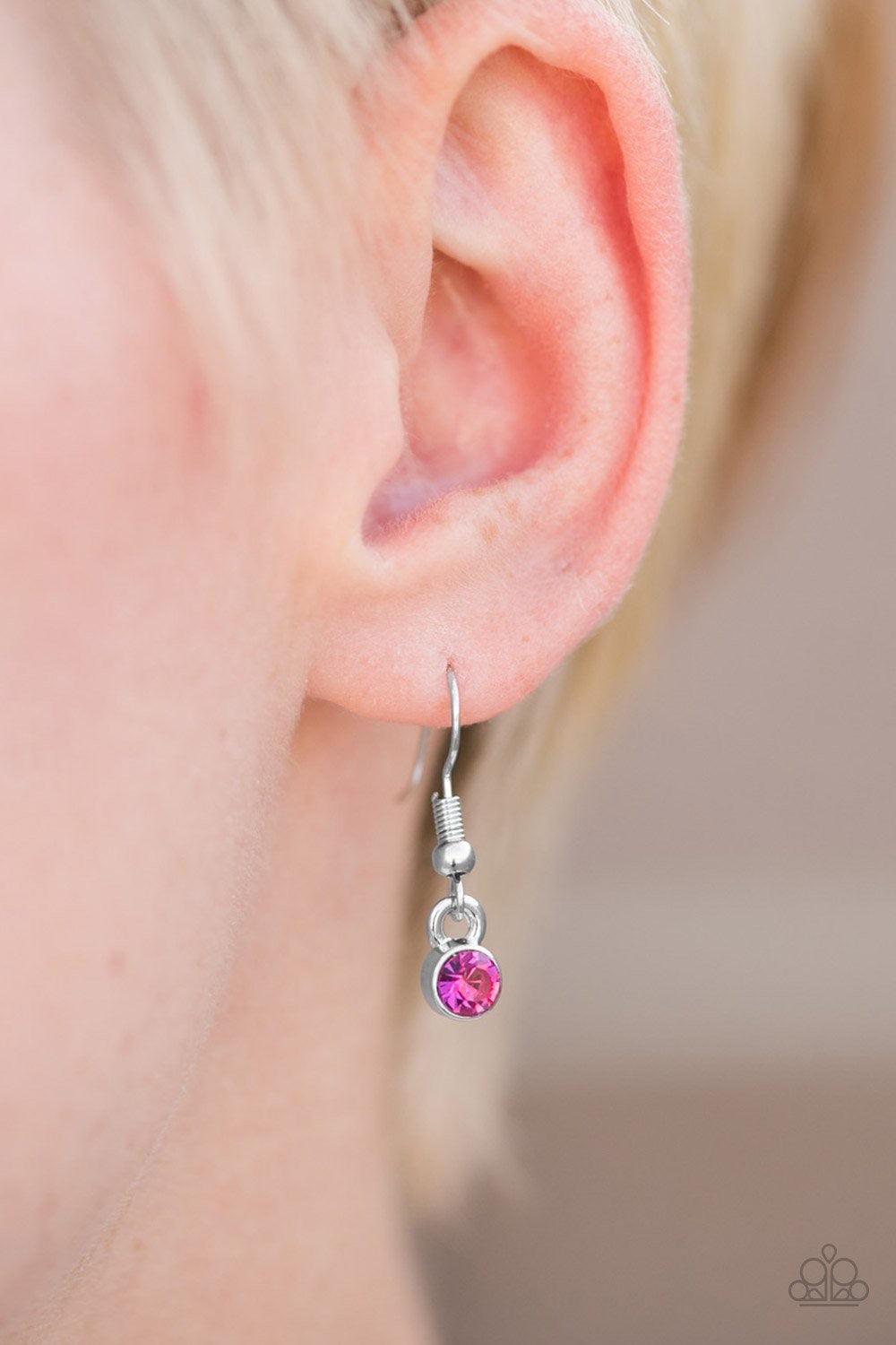 Paparazzi Accessories Rockin Rhinestones - Pink Glittery pink rhinestones join into a bowing pendant, creating a timeless frame below the collar. The sparkling rhinestones gradually increase in size as they near the center of the pendant for a classic fin