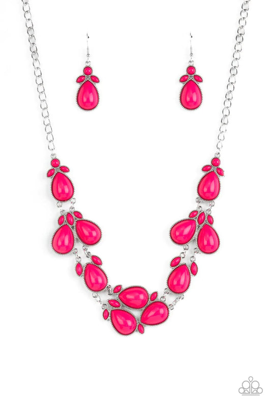 Paparazzi Accessories Botanical Banquet - Pink A flamboyant collection of bubbly pink round, teardrop, and marquise beads cluster in leafy frames below the collar for a flauntable pop of color. Features an adjustable clasp closure. Sold as one individual