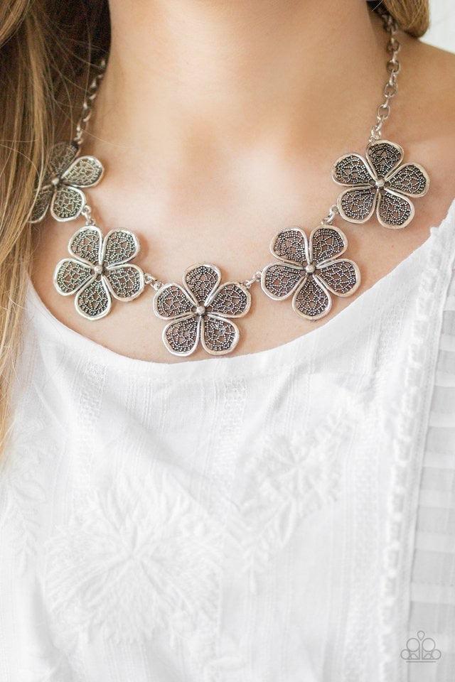Paparazzi Accessories No Common Daisy - Silver Featuring lace-like petals, glistening silver daisies link below the collar for a seasonal look. Features an adjustable clasp closure. Jewelry