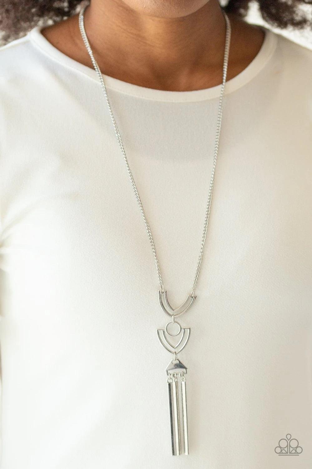 Paparazzi Accessories Confidently Cleopatra - Silver Two airy geometric silver frames link at the bottom of a lengthened silver chain, creating a stacked pendant. Rectangular bars swing from the bottom of the pendant, adding a bold movement to the tribal