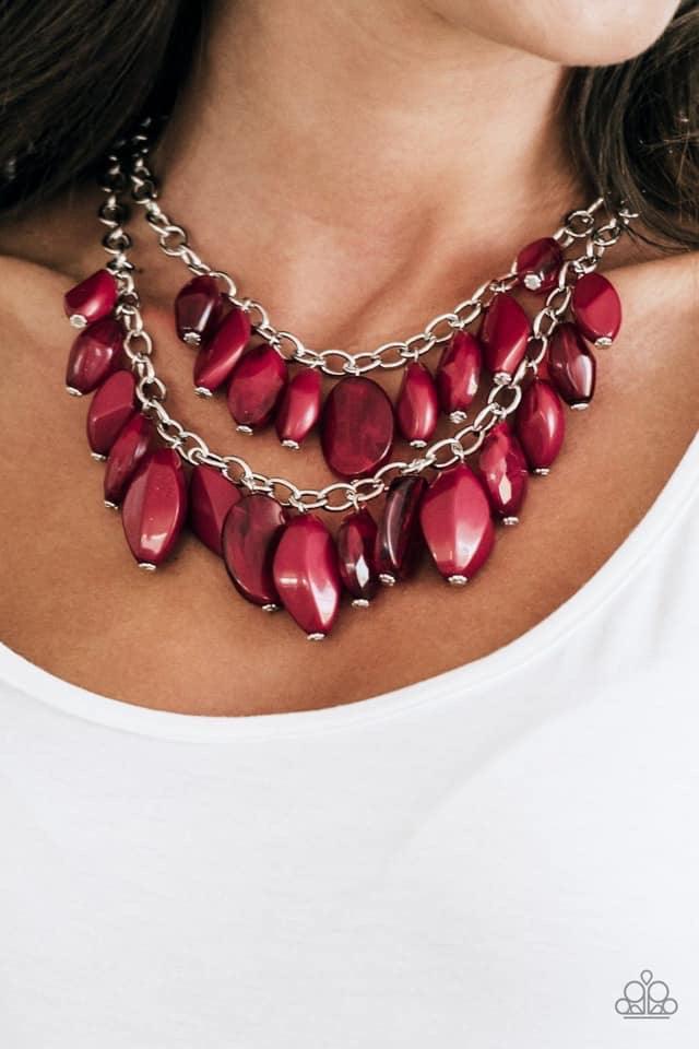Paparazzi Accessories Royal Retreat - Red Featuring the robust shade of Wine, faceted, opaque, and crystal-like beads swing from two rows of silver chains, creating vivacious layers below the collar. Features an adjustable clasp closure. Jewelry