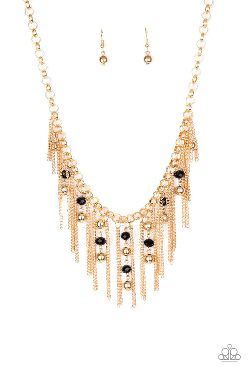 Paparazzi Accessories Ever Rebellious - Gold Glistening gold chains and strands of black crystal-like beads and glistening gold beads stream from the bottom of a bold gold chain, creating a sassy fringe below the collar. Features an adjustable clasp closu