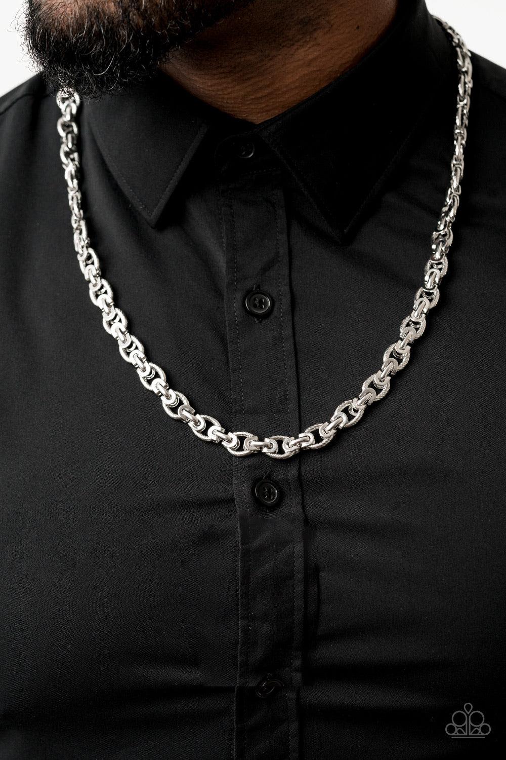 Paparazzi Accessories Grit And Gridiron - Silver Textured silver links are joined together with sleek silver fittings across the chest, creating an ornate chain. Features an adjustable clasp closure. Jewelry
